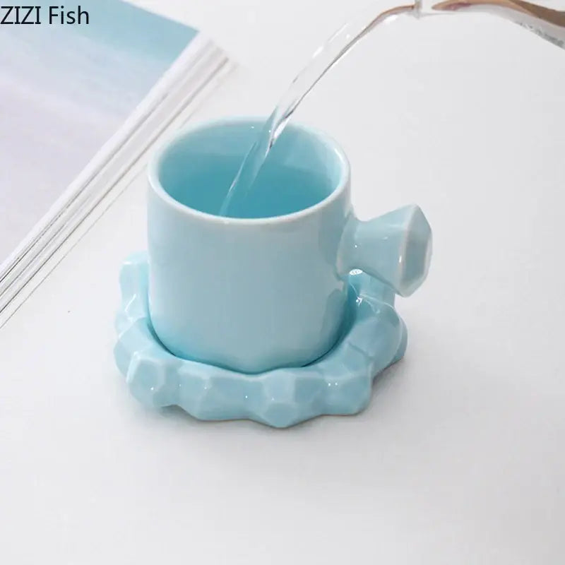 A light blue bowknot decor porcelain cup and saucer set with faceted handle and geometric pattern from decorbites