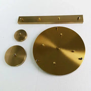 Brass wall-mounted coat rack with circular and rectangular plates in brushed metallic finish for decorbites ceiling plate
