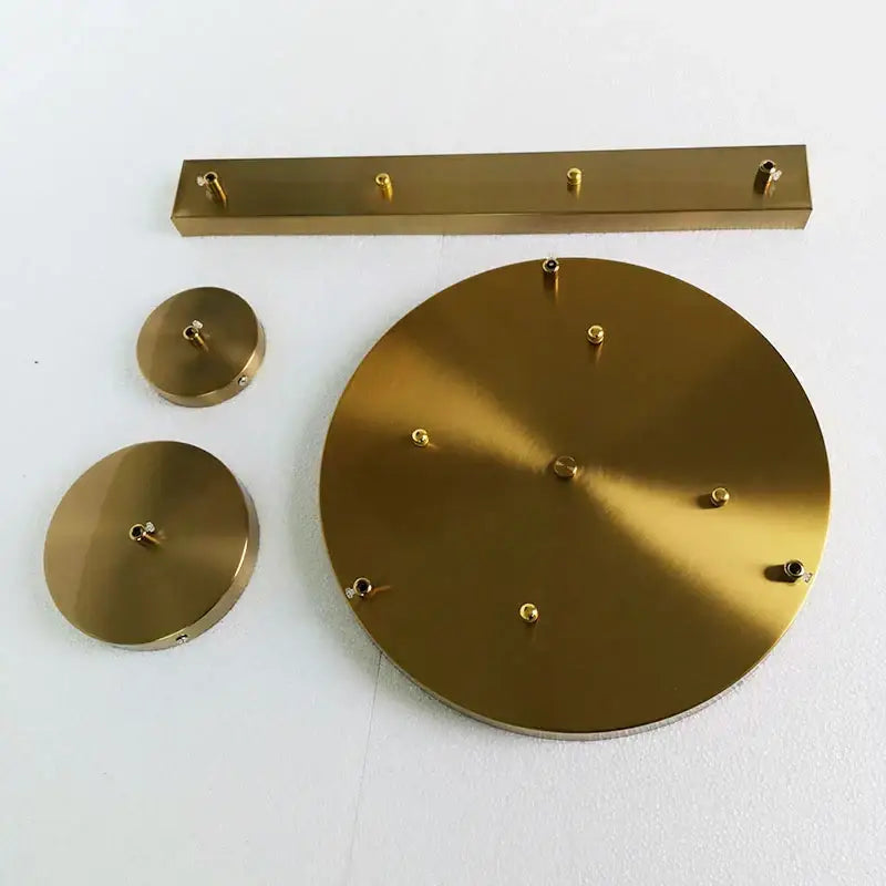 Brass wall-mounted coat rack with circular and rectangular plates in brushed metallic finish for decorbites ceiling plate