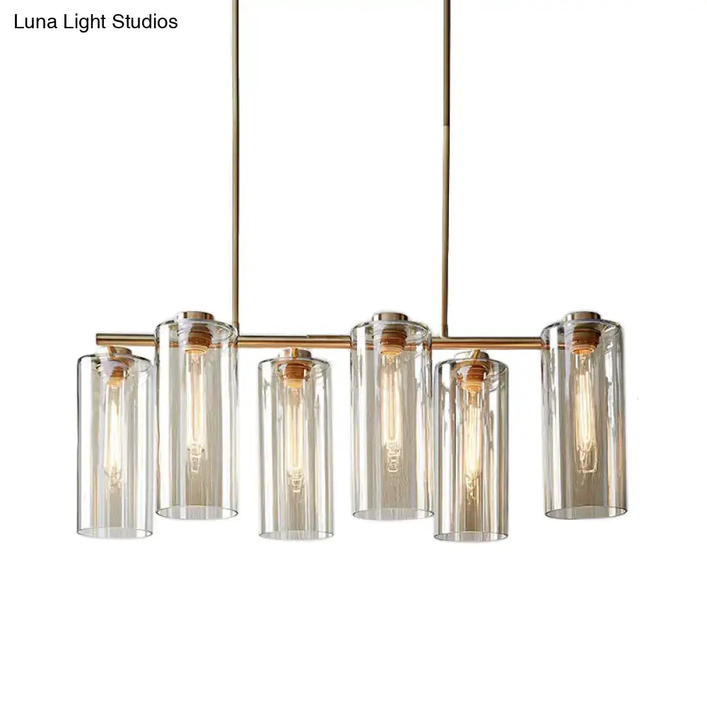 Modern brass 5 light chandelier with cognac glass cylinders and exposed bulbs ideal for dining room island light