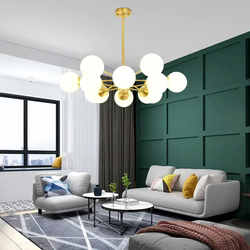 Modern brass 8-light glass ball pendant lights featuring gold-toned frame and frosted decorbites glass ball bulbs