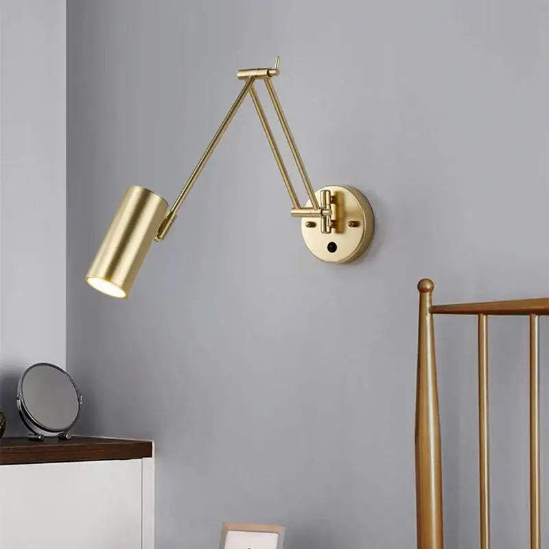 Modern brass adjustable e27 led wall lamp with gold finish cylindrical head and articulated arms for bedroom reading light