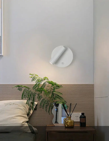 White circular wall-mounted modern brass adjustable led wall reading lamp with sleek minimalist design for bedroom decorbites adjustable led