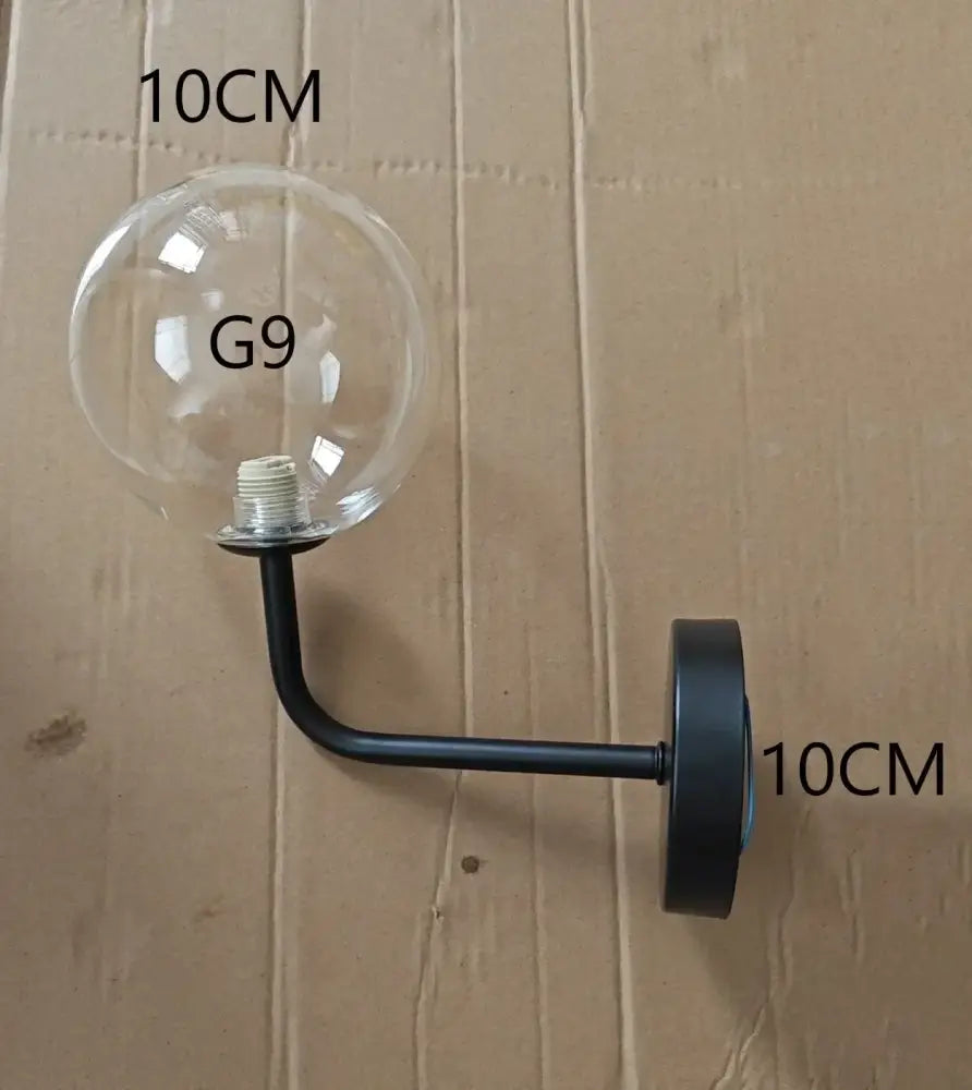 Black metal wall lamps with clear glass ball housing perfect for modern bedroom decorbites glass ball wall lighting