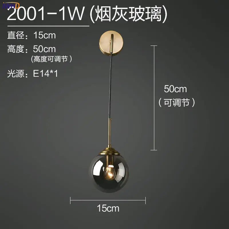 Modern brass and amber decorbites glass ball wall lamp with smoked glass globe and brass finish for bedroom lighting