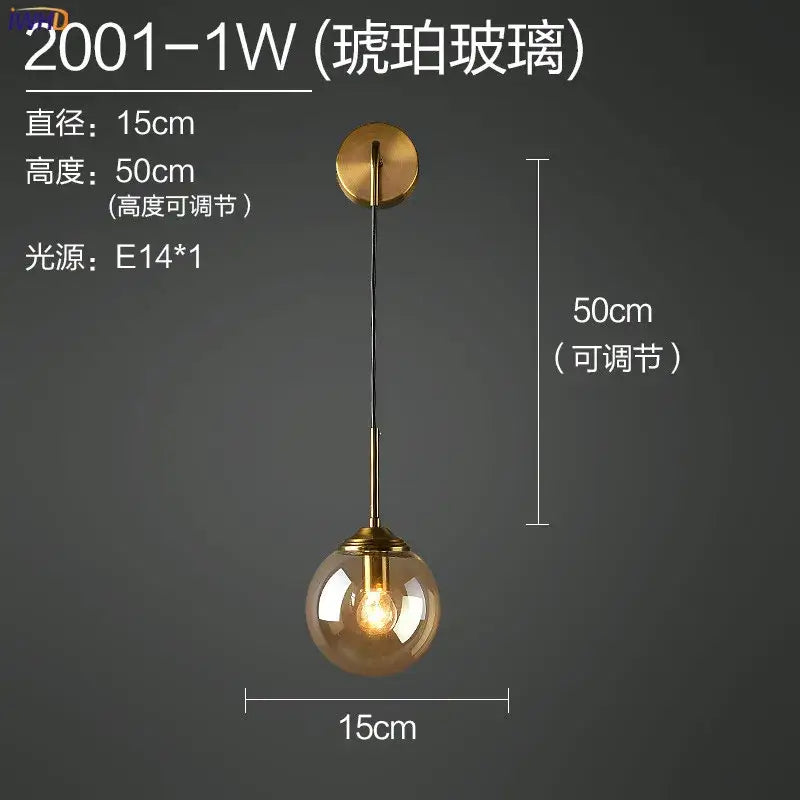 Modern brass and amber decorbites glass ball wall lamp with warm amber hue and brass-finished metal hardware for bedroom