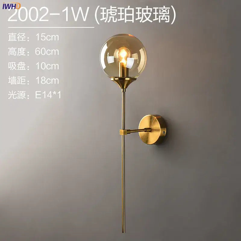 Modern brass and amber decorbites glass ball wall lamp with gold-toned metal arm for bedroom led wall lighting