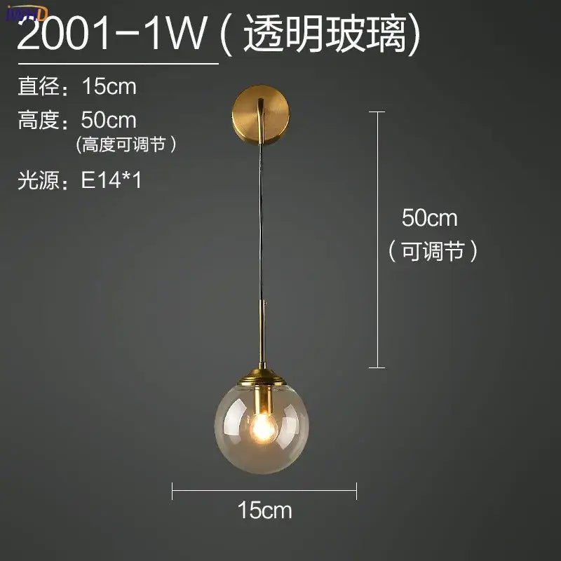 Modern brass and amber decorbites glass ball wall lamp with sleek transparent glass and brass finished metal fixture