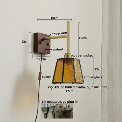Modern brass and amber glass copper led wall light with textured amber glass shade and walnut-finished mounting plate