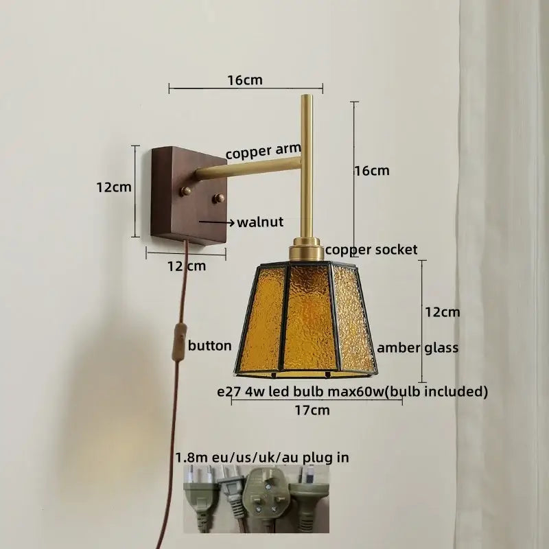 Modern brass and amber glass copper led wall light with textured amber glass shade and walnut-finished mounting plate