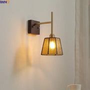 Brass-finished modern wall lights featuring textured amber glass copper led wall sconce for bedroom use
