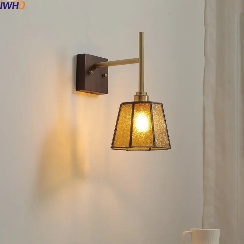 Brass-finished modern wall lights featuring textured amber glass copper led wall sconce for bedroom use