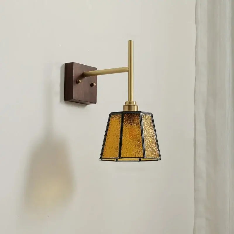 Modern brass and amber glass copper led wall light with textured glass shade for bedroom sconce lighting solution