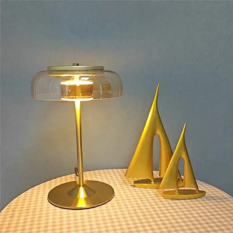 Modern brass and amber glass mushroom table lamp with gold finish and clear glass dome casting warm glow decorbites elegant mushroom