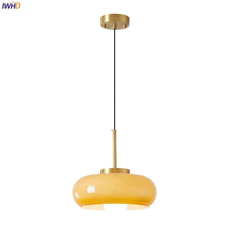 Modern pendant light with brass-finished frame and amber glass shade ideal for kitchen led lighting decorbites copper bauhaus