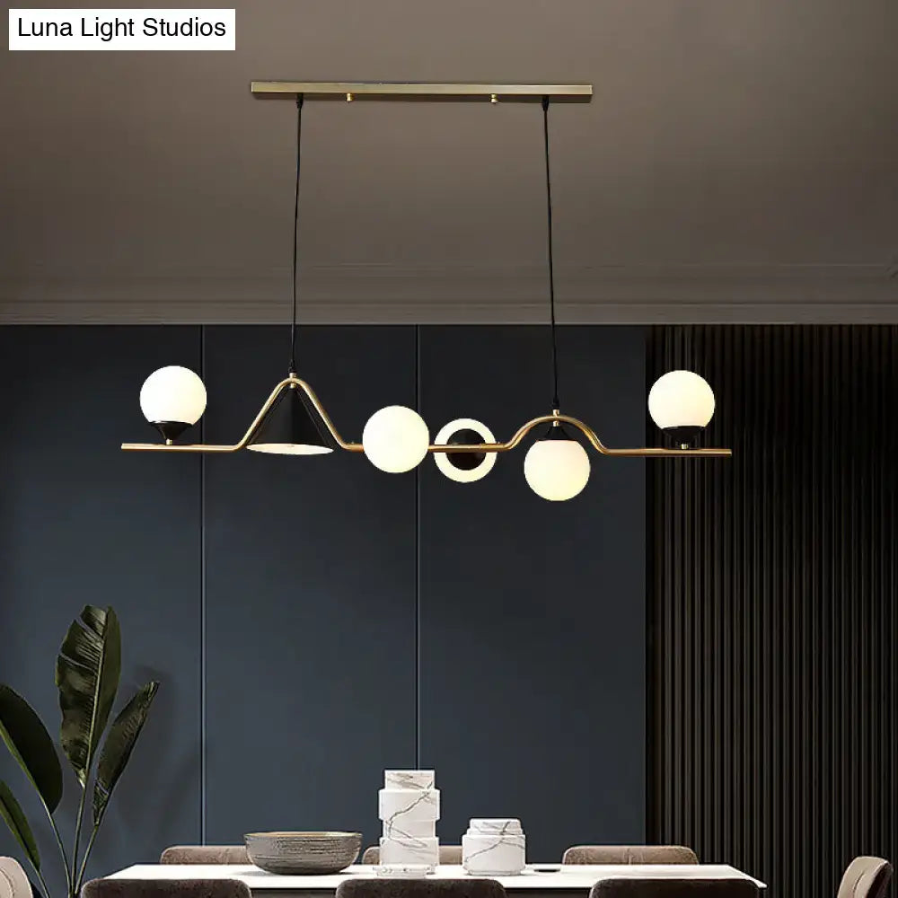 DecorBites minimalist gold metal dining pendant lamp with brass-toned ball hanging island light and geometric glass globes
