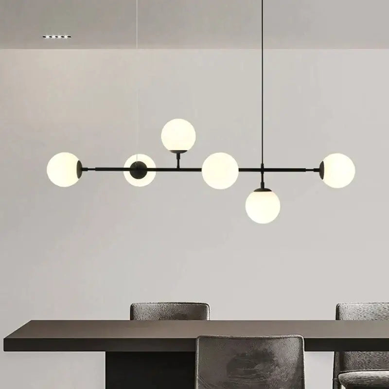 Modern black metal chandelier with six frosted art glass ball bulbs in black art glass for living room lighting