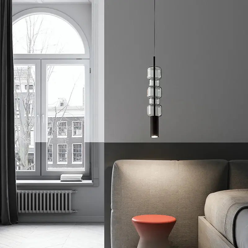 Modern brass and black cylindrical glass pendant light with three clear glass orbs for kitchen decorbites cylindrical glass pendant