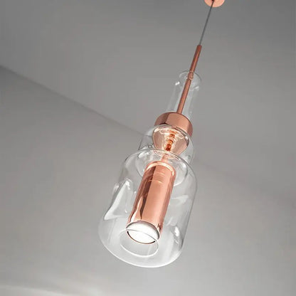 Modern brass and black cylindrical glass pendant light with copper-toned clear glass shades for kitchen decorbites cylindrical glass pendant