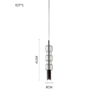 Modern brass and black cylindrical glass pendant light with three stacked clear glass cylinders for kitchens