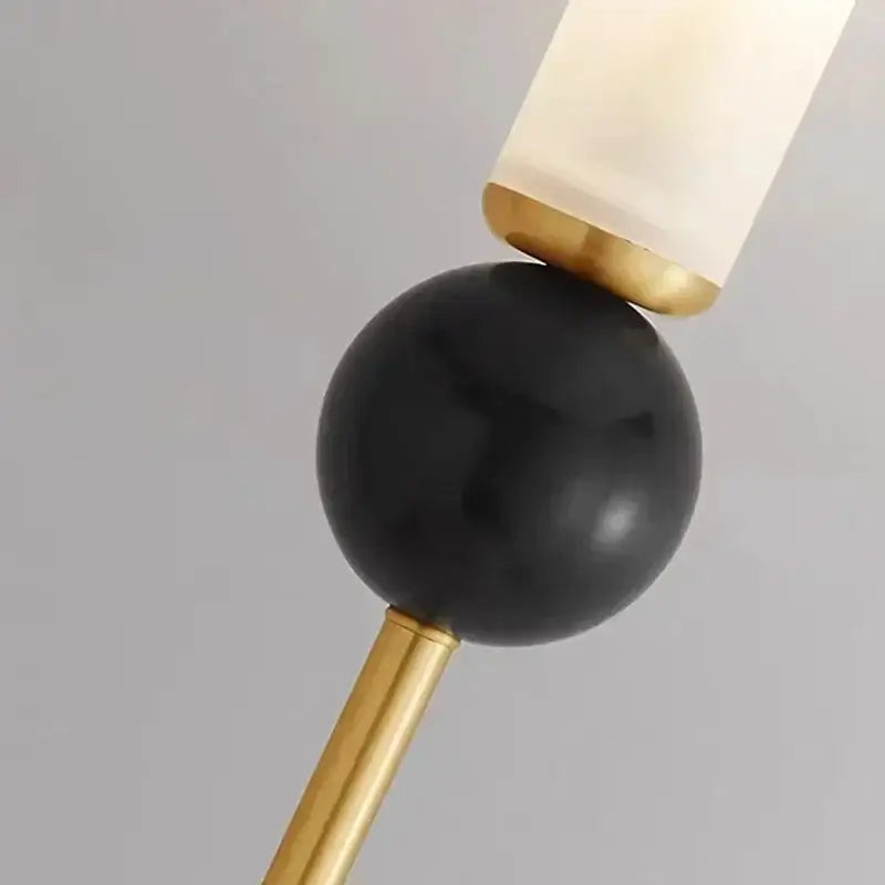 Modern brass and black decorbites foyer hallway lamp with black spherical lampshade and frosted glass diffuser