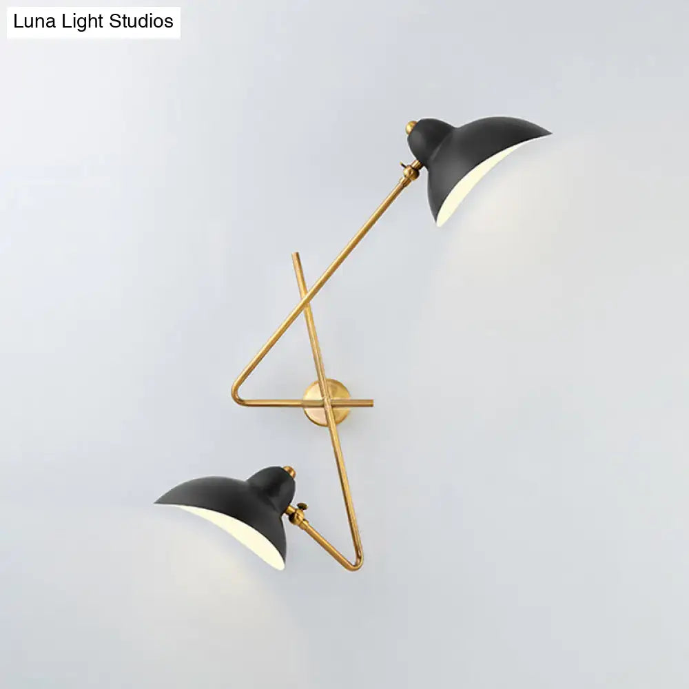 Black and brass metal duckbill wall sconce with sleek angular design modern wall sconce lamp for living room