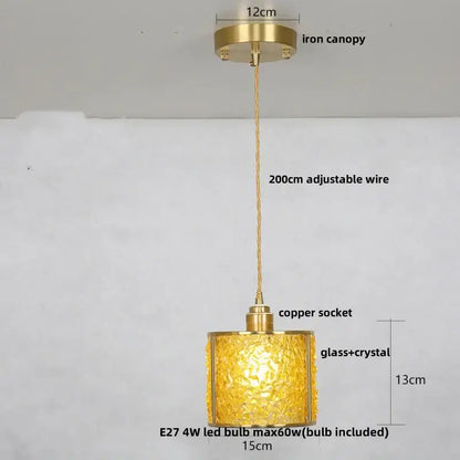 Modern brass and blue crystal glass pendant light fixture with golden glass, brass canopy, and adjustable wire