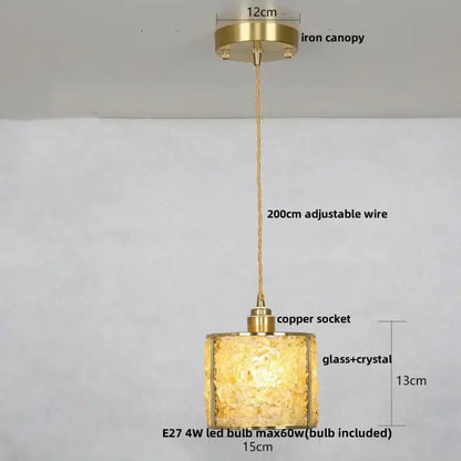 Modern brass and blue crystal glass pendant light fixture with warm golden textured shade for kitchen use