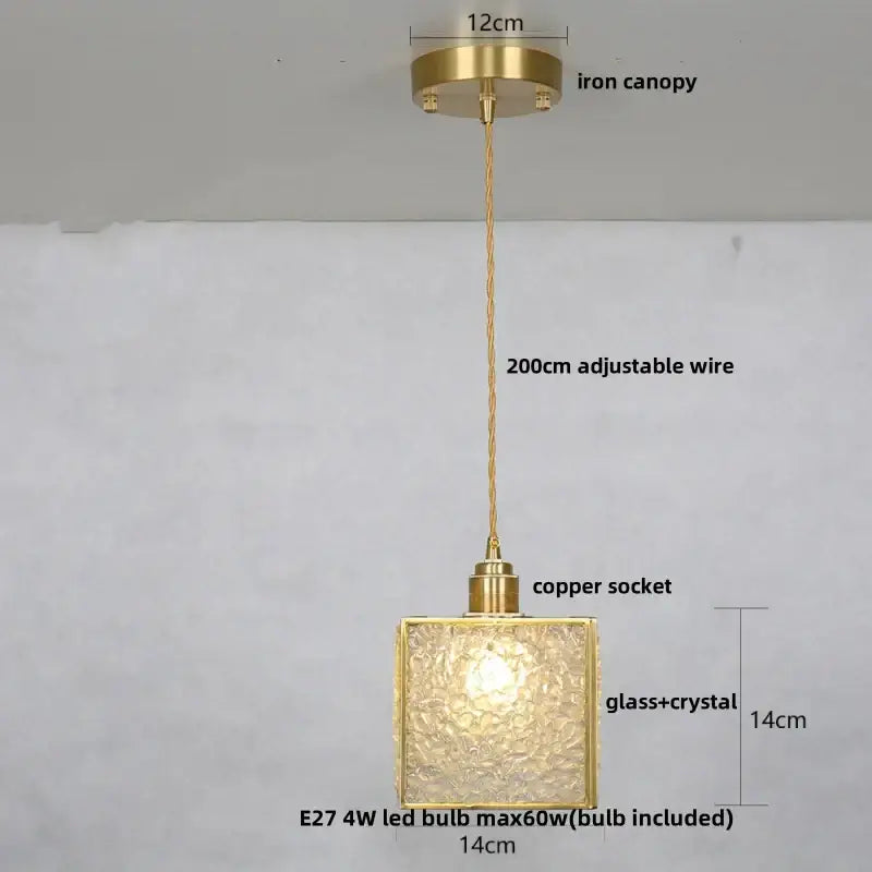 Modern brass pendant light with gold-toned square textured glass crystal led shade and iron canopy for kitchen use