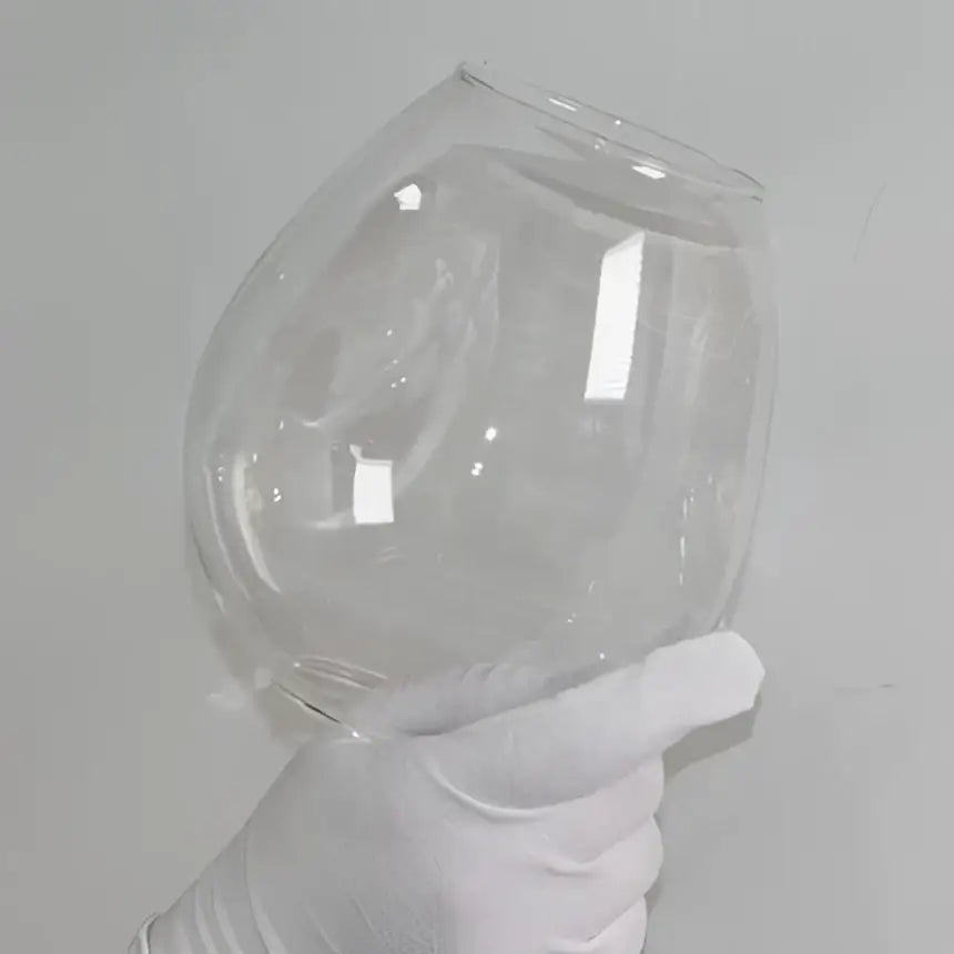 Clear glass fishbowl with smooth edges and flared rim featured in modern brass and blue glass iron ball chandeliers for dining room