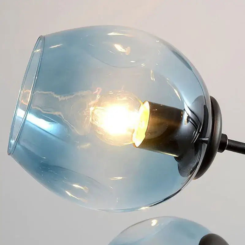 Modern brass and blue glass iron ball chandelier with translucent globe lampshade and warm bulb for dining room lighting