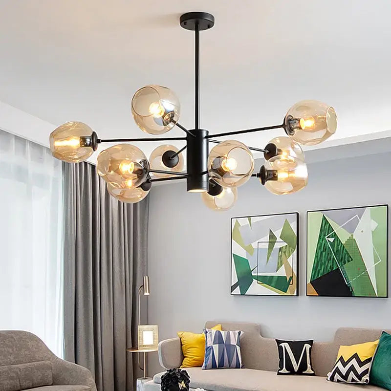 Modern black metal iron ball chandelier with multiple amber glass globe bulbs for dining room lighting