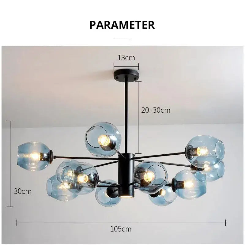 Modern brass and blue glass iron ball chandelier with black metal arms designed for dining room lighting