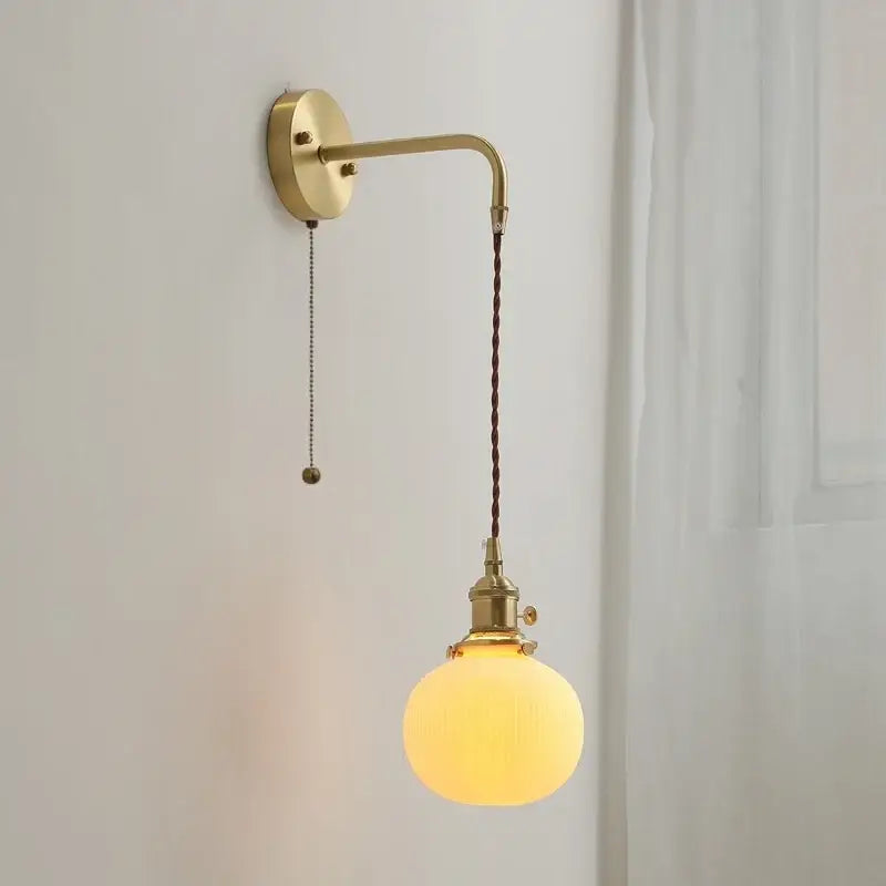 Modern brass and ceramic copper led wall lamp with curved arm and twisted cord suspension for bedroom decorbites ceramic copper