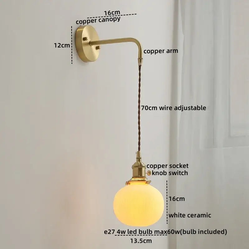 A warm glowing white ceramic globe wall lamp with brass copper arm and 70cm adjustable wire decorbites ceramic copper led