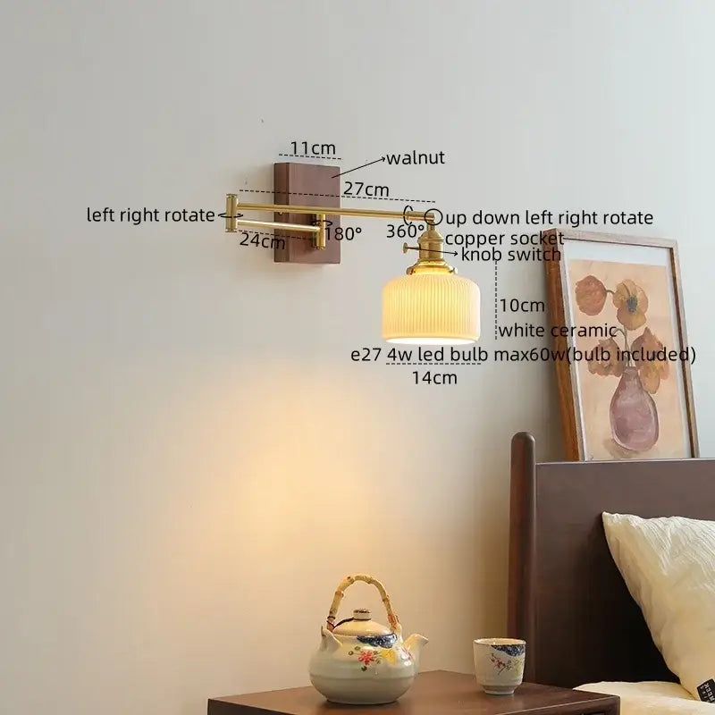 A warm-toned brass wall light with a white ceramic walnut led lampshade and walnut-finished mounting bracket