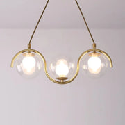 Modern brass and clear glass globe pendant light with three clear glass shades and adjustable chain cord length fixture width
