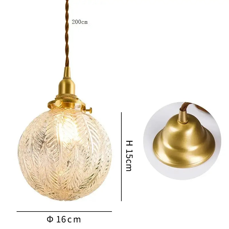 Modern brass and clear glass LED pendant light with gold-toned fixture and feather-etched globe for dining room decorbites clear glass