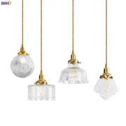 Four elegant modern brass and clear glass led pendant lights with textured clear glass shades for dining room decorbites clear glass