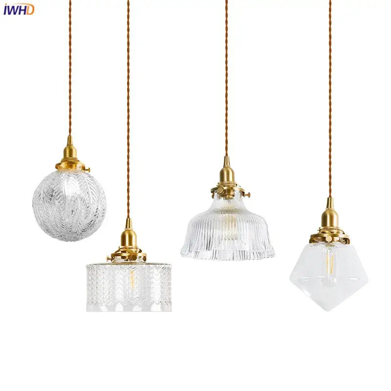 Four elegant modern brass and clear glass led pendant lights with textured clear glass shades for dining room decorbites clear glass