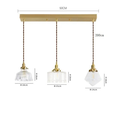 Modern brass pendant light with three clear glass led shades suspended by twisted copper cords for dining room decorbites clear glass