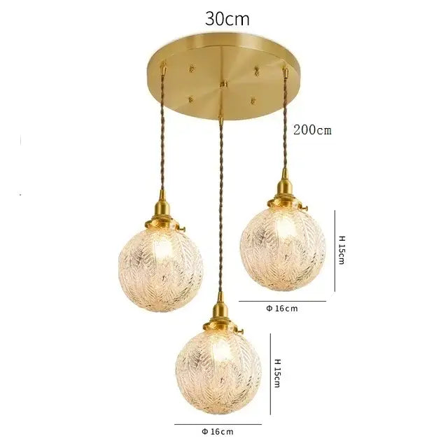 Modern brass pendant light with three textured clear glass led shades suspended by braided cords for dining room decorbites clear glass