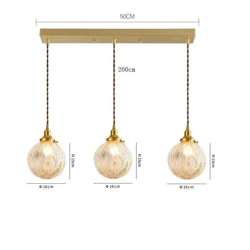 Modern brass pendant light with gold-toned three-light frosted glass globes and twisted bronze cords for dining room decorbites clear glass led