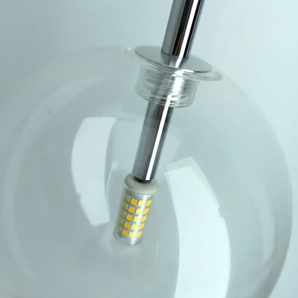 Modern brass and clear glass pendant light with a chrome stem and led bulb featuring yellowish leds decorbites clear glass chandelier