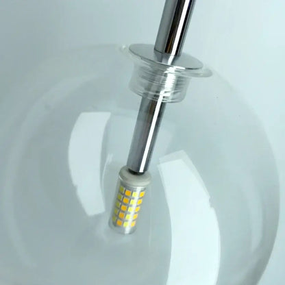 Modern brass and clear glass pendant light with a chrome stem and led bulb featuring yellowish leds decorbites clear glass chandelier