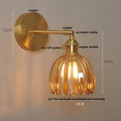 A modern brass wall light featuring a warm amber glass fluted design and copper hardware for stylish decorbites clear glass decor