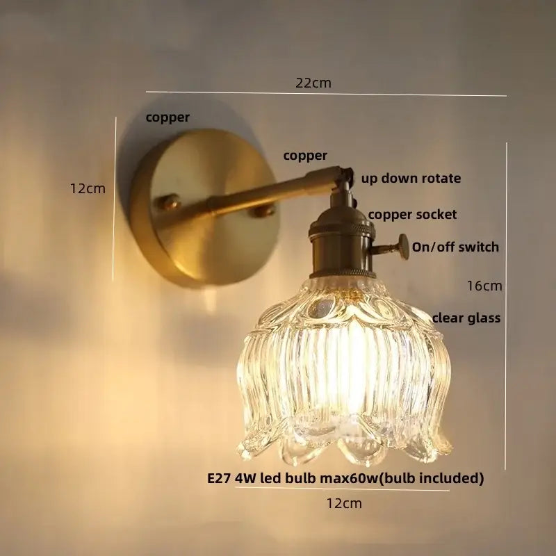 Modern brass and clear glass wall light featuring an antique brass-finished copper sconce with clear glass shade decorbites clear glass