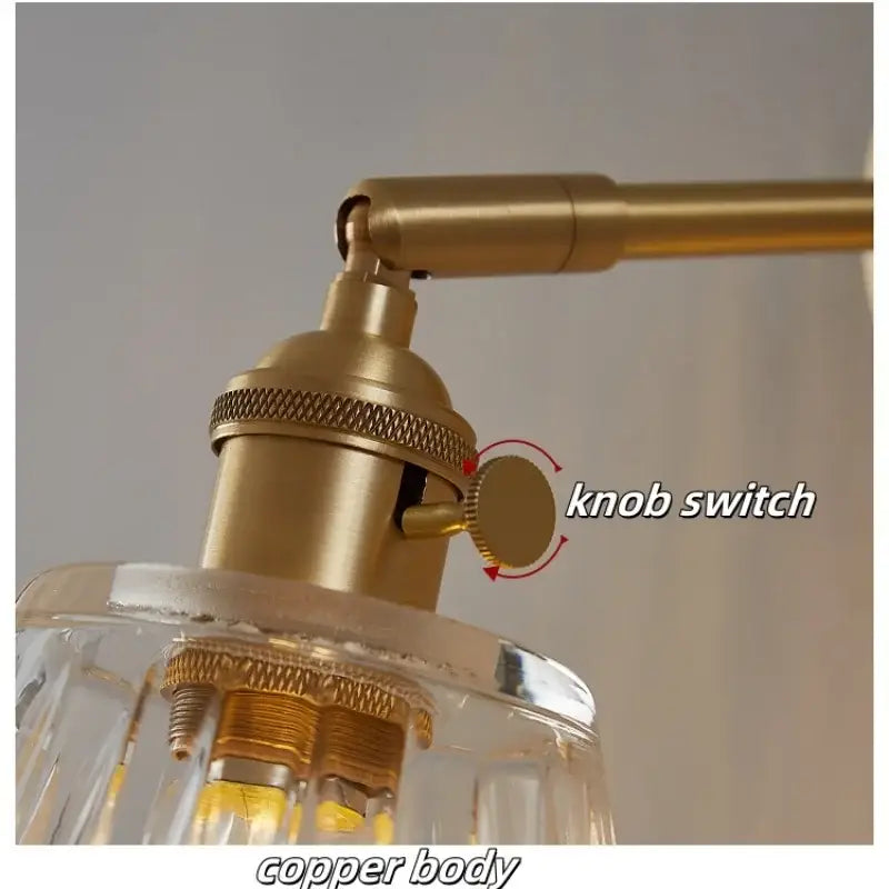 Modern brass and clear glass wall lights featuring copper-finished industrial lamp with textured knob switch decorbites clear glass