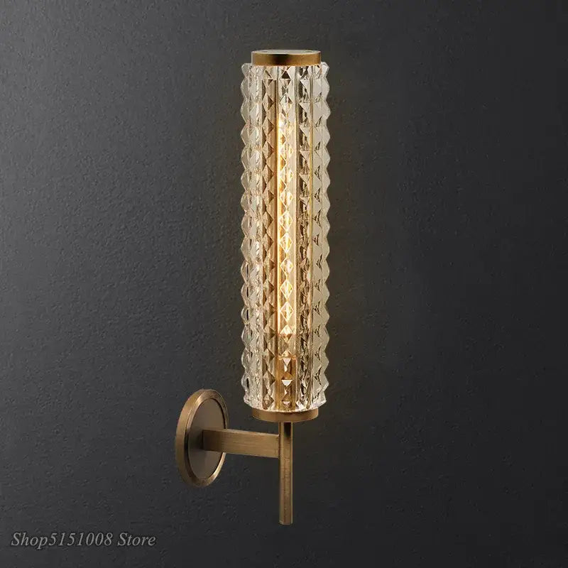 Modern brass and crystal copper wall sconce with gold-toned metal frame and clear faceted glass panels for decorbites lighting