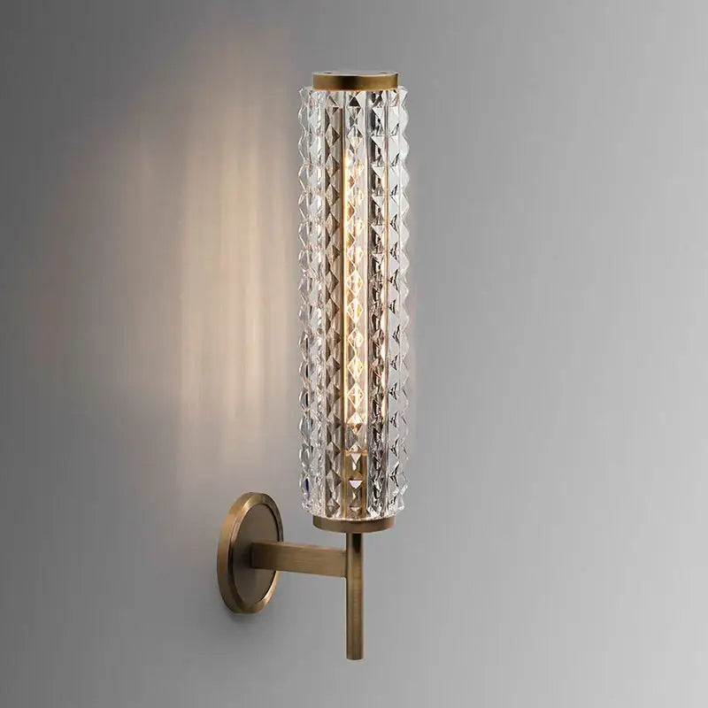 Modern brass and crystal copper wall sconce with faceted glass and metal accents for living room lighting decorbites crystal copper